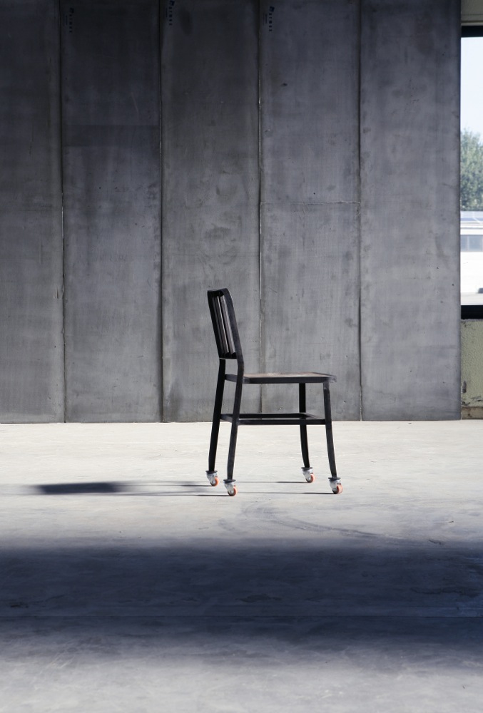 Metal Chair with wheels & leather seat by Heerenhuis
