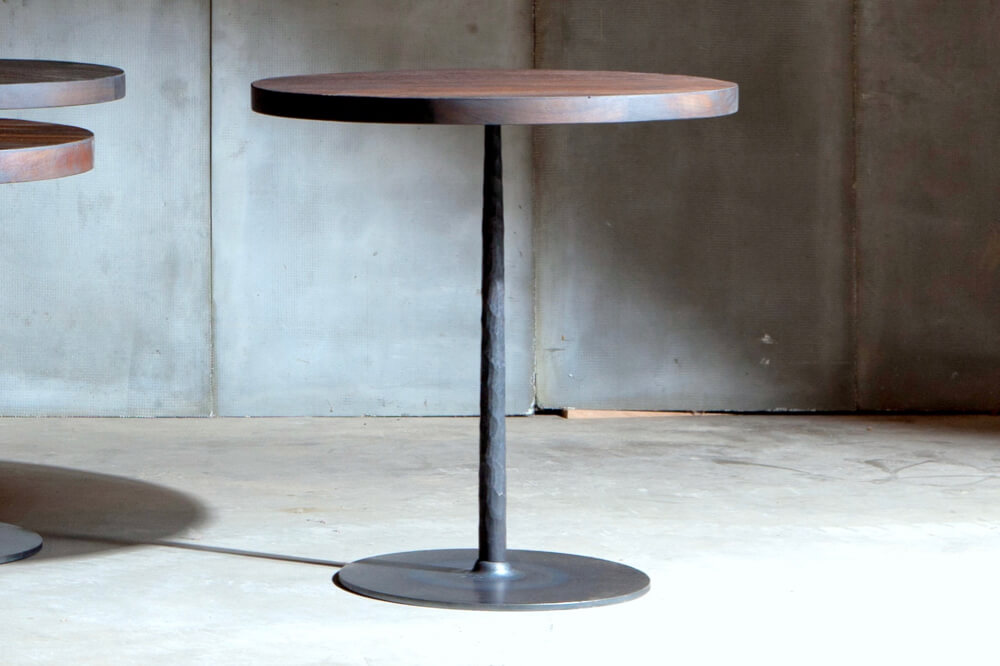 Spike table with reclaimed teak top over metal base - made to measure by Heerenhuis