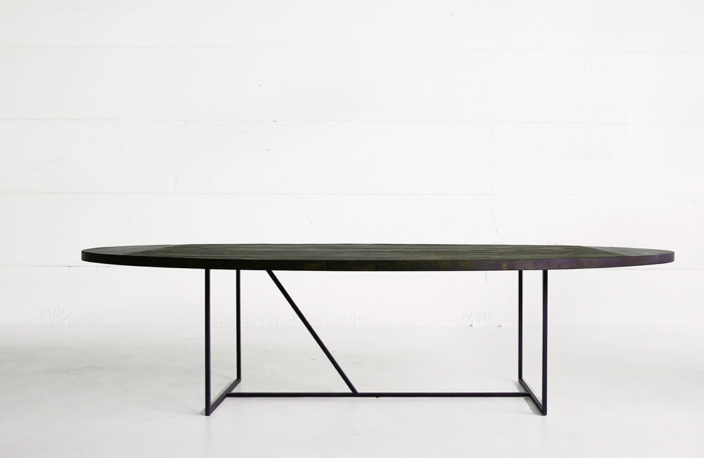 Mesa OV table - reclaimed teak top with charcoal finish over a solid metal base by Heerenhuis