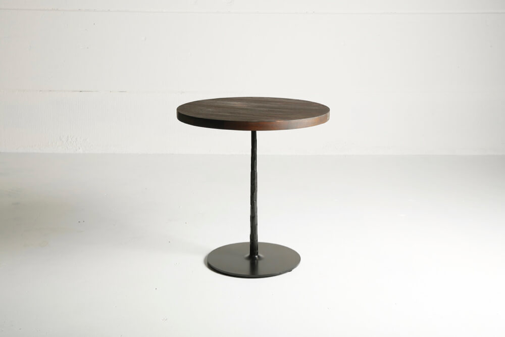 Spike table with reclaimed teak top and charcoal finish by Heerenhuis