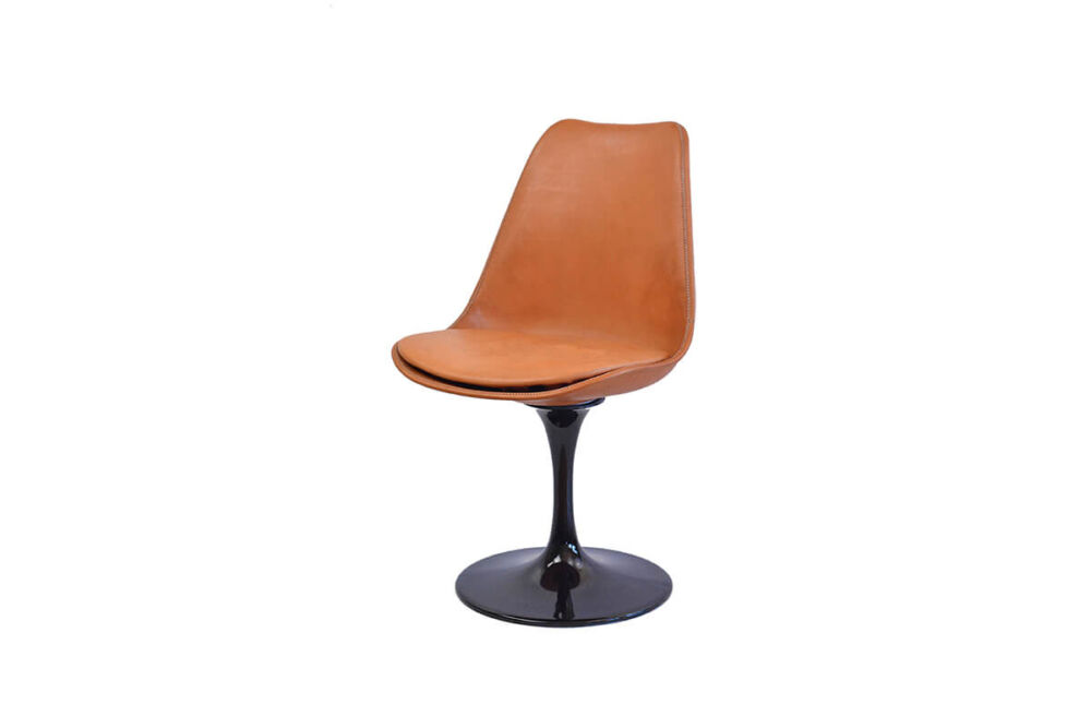 Revolving dining chair in natural leather with black swivel base by Sol & Luna