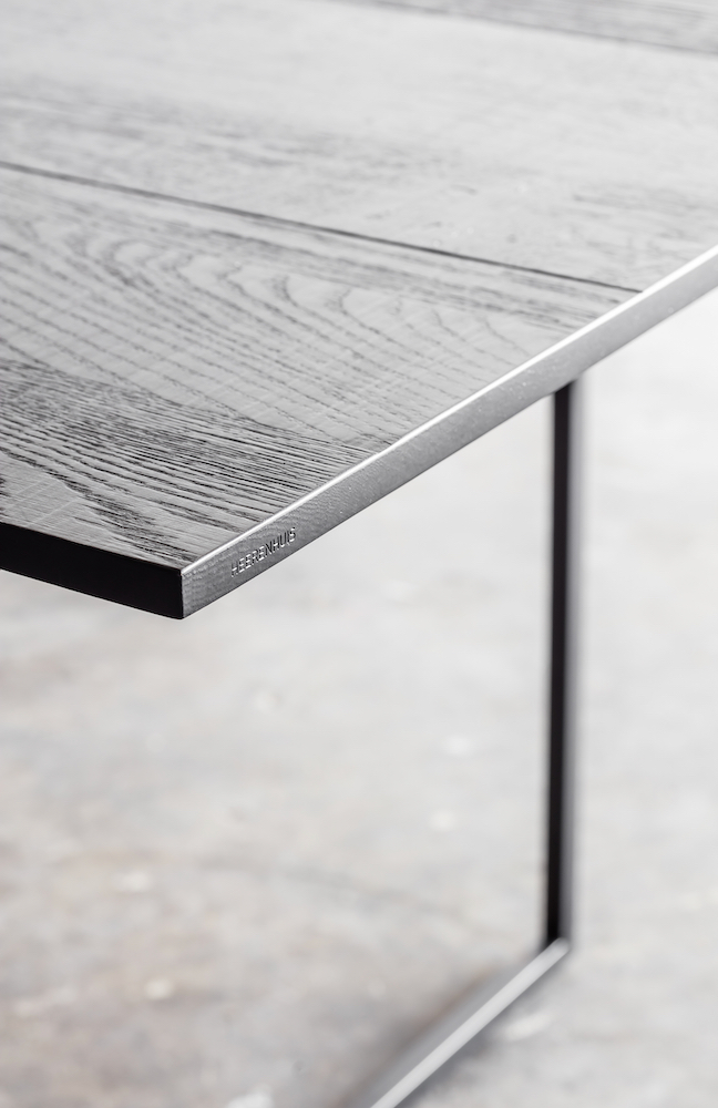 Mesa Nero table by Heerenhuis: blackened oak over a solid steel base