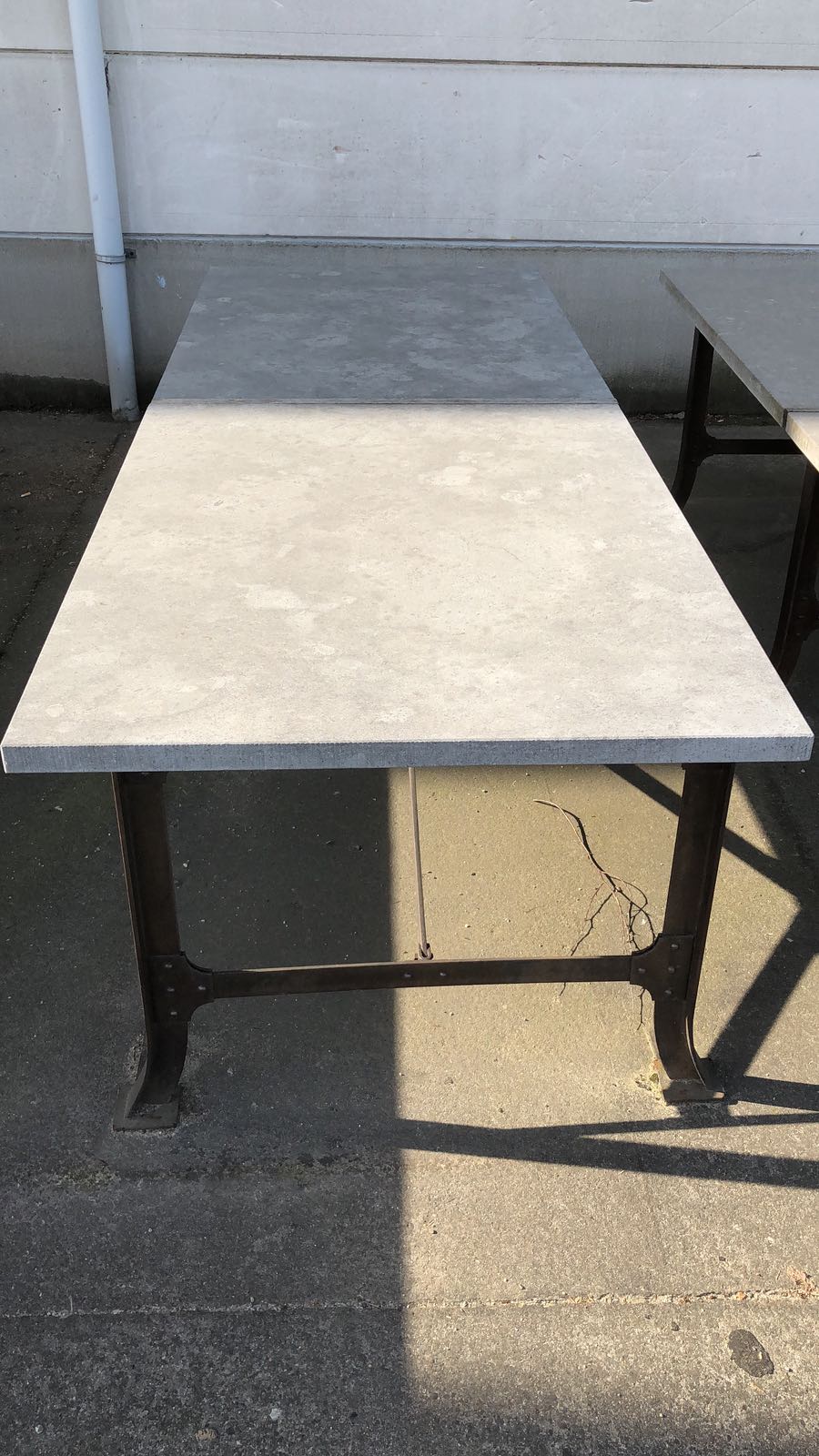 Bluestone outdoor table by Heerenhuis: set over a metal base